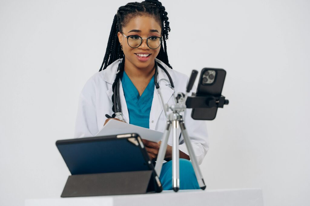 Black, female doctor giving a virtual consultation